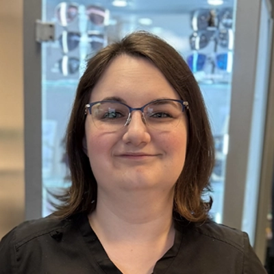 Emily Miszewski smiling in a black shirt.