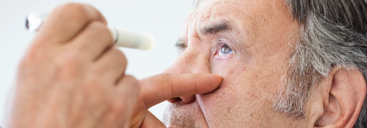 Eye Doctor Sault Ste. Marie MI Eye Condition A man receiving an eye exam.