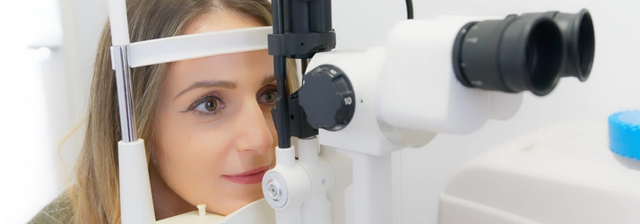 A woman getting her eyes looked at.